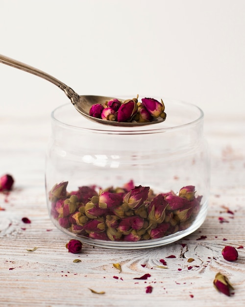 Close-up jar filled with organic mini roses