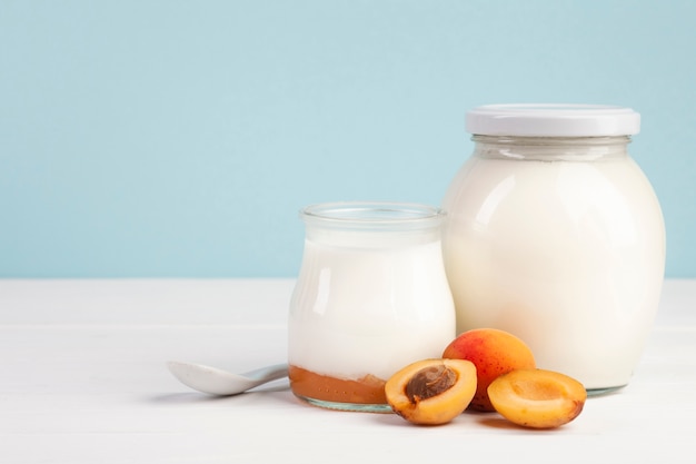 Close-up  jars of milk and apricots