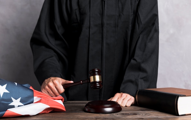 Free photo close-up judge striking the gavel