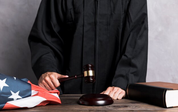 Close-up judge striking the gavel