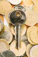 Free photo close-up of key and coins