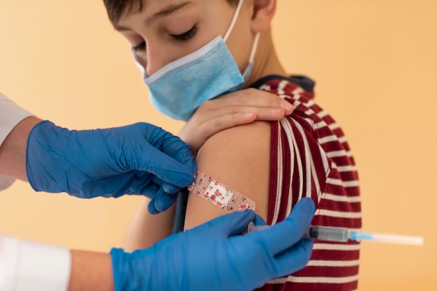 Close up kid after getting vaccine