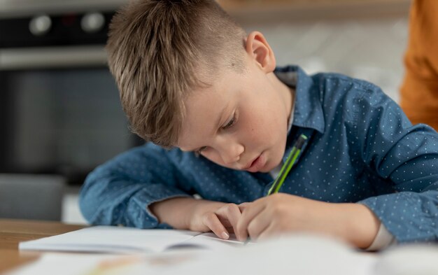 Close up kid doing homework