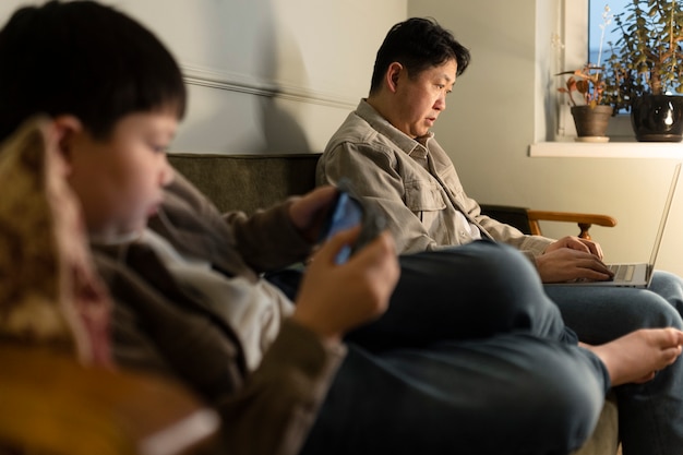 Free photo close up kid and father with devices