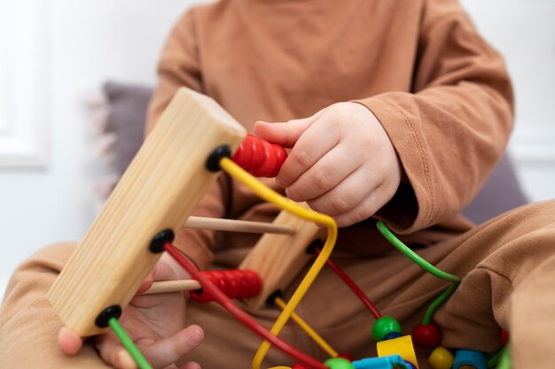 Close up kid holding educational game