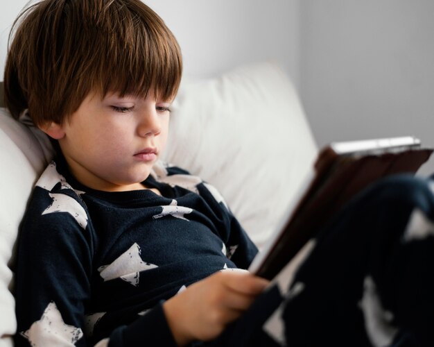 close-up kid holding tablet