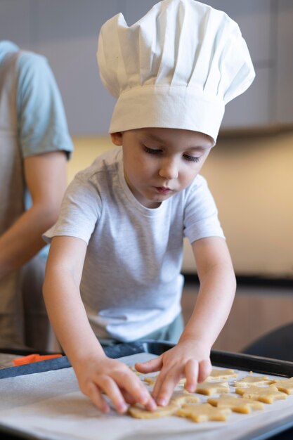 Close-up kid making cookies