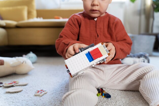 Close up kid repairing car toy