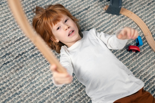 Close up on kid in their room having fun