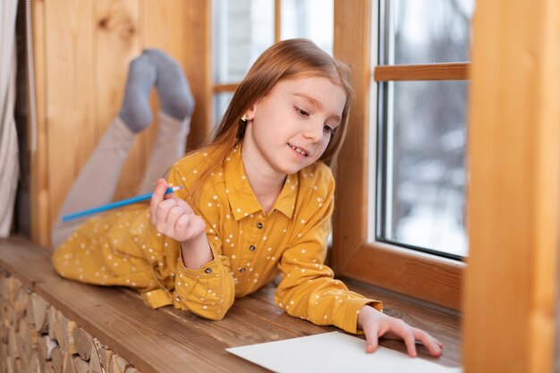 Close up on kid in their room having fun