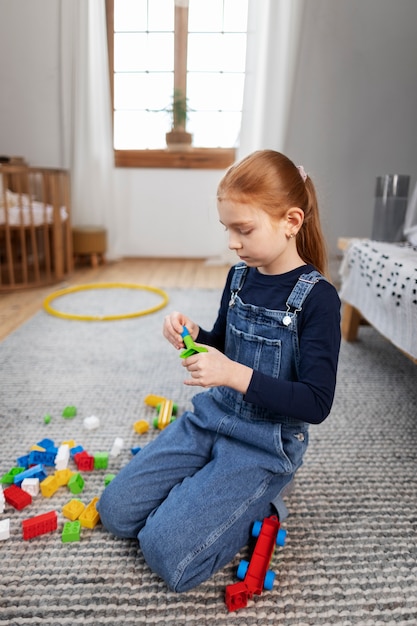 Close up on kid in their room having fun