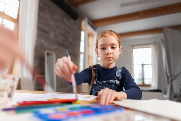 Close up on kid in their room having fun