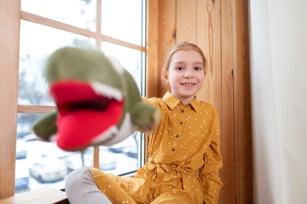 Close up on kid in their room having fun