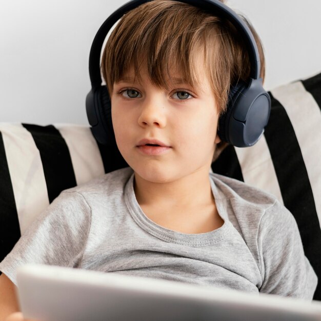 Close-up kid wearing headphones