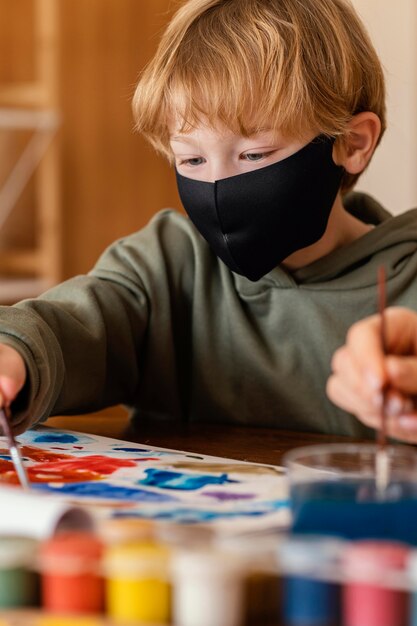 Close-up kid wearing mask