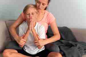 Free photo close up kid and woman meditating