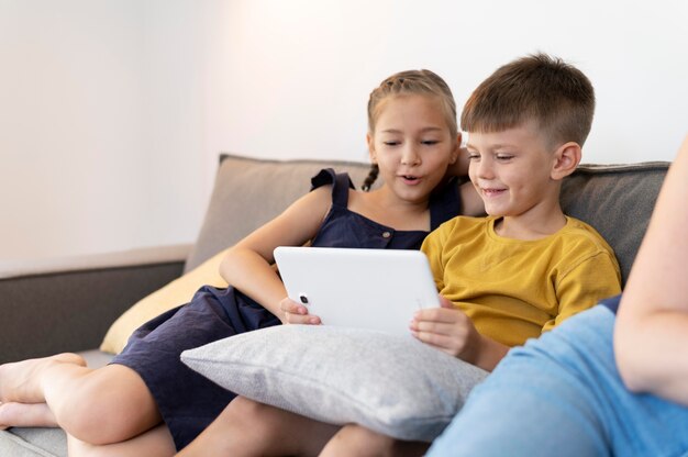 Close up kids holding tablet