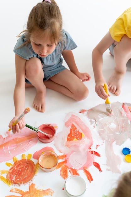 Close up kids painting together