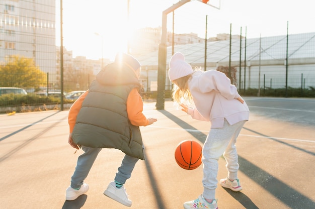 Close up on kids playing basketball