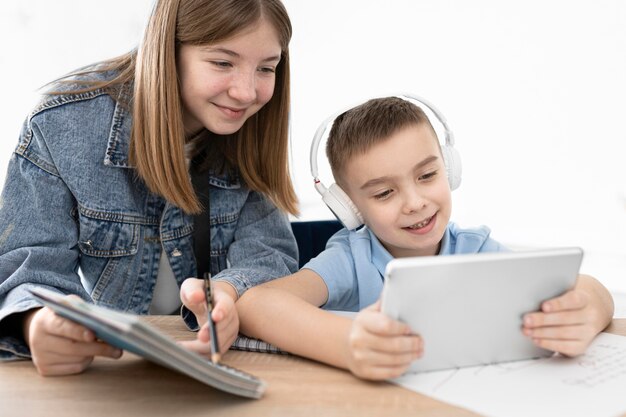 Close up kids studying together