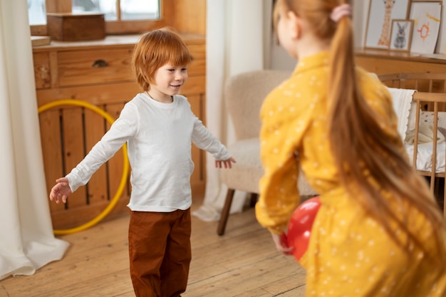 Close up on kids in their room having fun