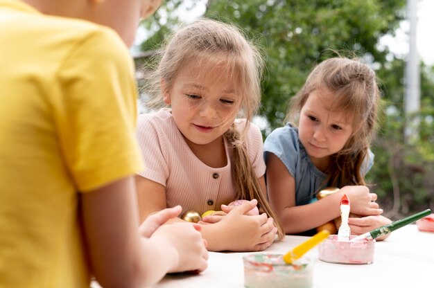 Close up kids with brushes