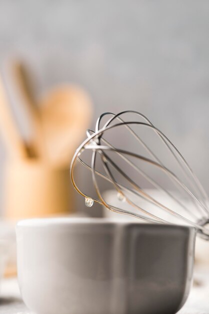 Close-up kitchen tools with whisk