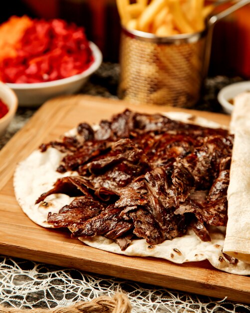 Close up of lamb doner kebab placed in flatbread