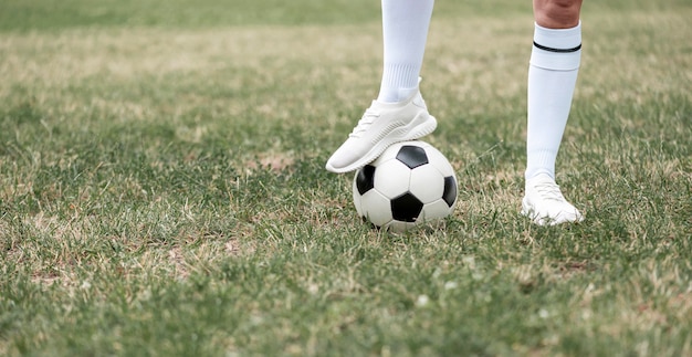 Close-up leg on soccer ball