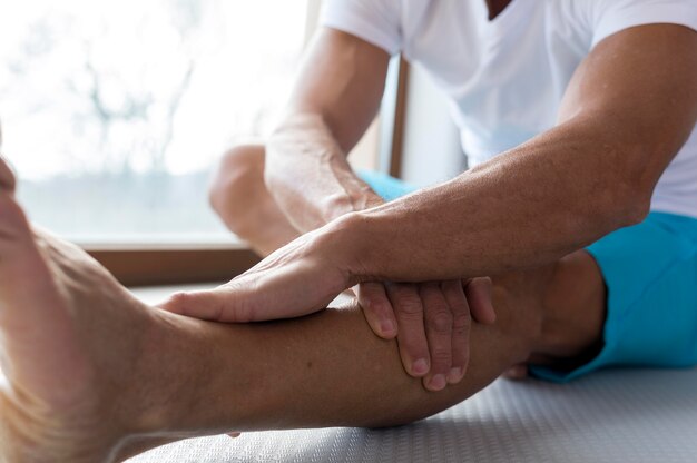 Close-up legs and hands doing stretching exercises