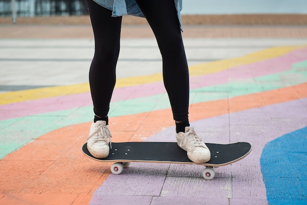 Free photo close up legs on skateboard