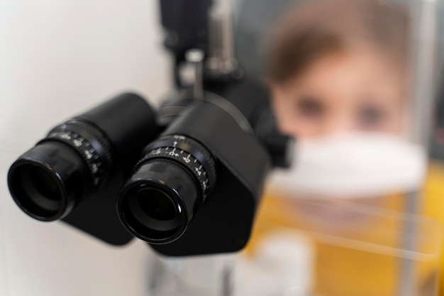 Close up little boy at eyes consult