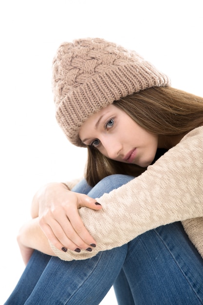 Close-up of lonely girl with wool cap