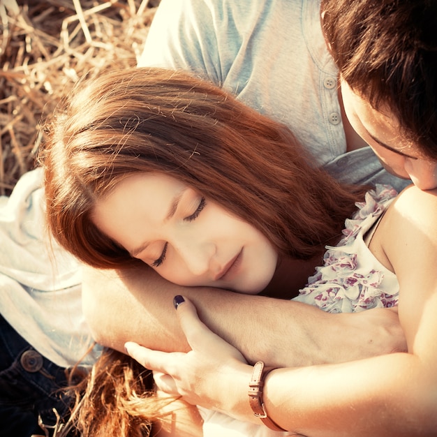 Close-up of loving woman lying on her boyfriend