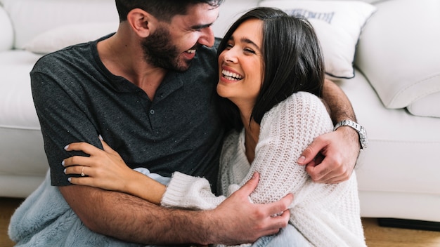 Close-up of loving young couple hugging each other