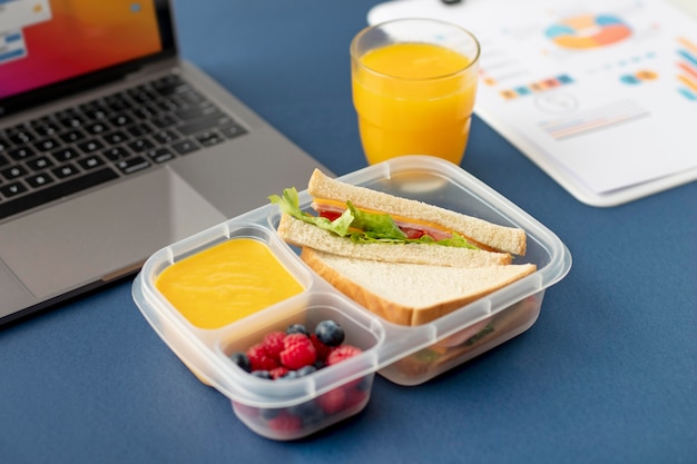 Free photo close up on lunchboxes with delicious food