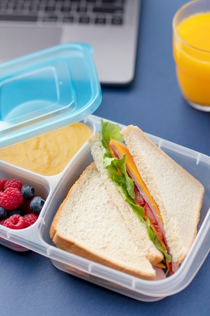 Free photo close up on lunchboxes with delicious food