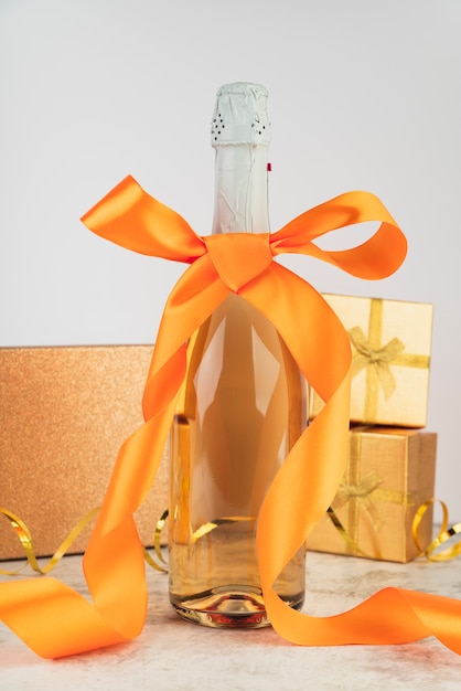 Close-up luxury champagne bottle with ribbon