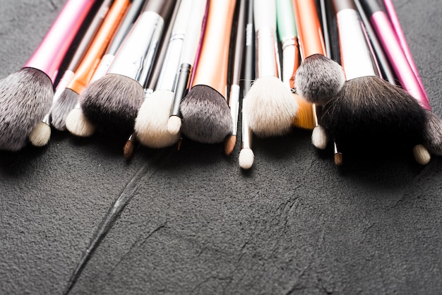 Free photo close-up makeup brushes on black