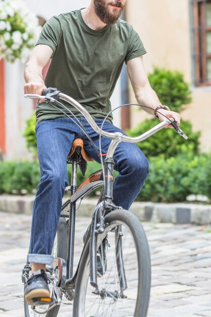 Close-up of a male cyclist riding bicycle