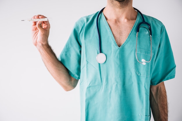 Close-up of a male doctor holding thermometer