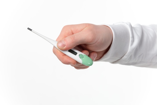 close up of male hands holding thermometer taking temperature