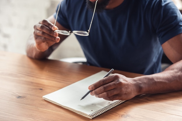 Close up of male hands, working in office