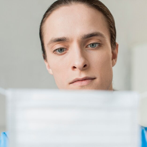 Close-up male nurse with medical mask