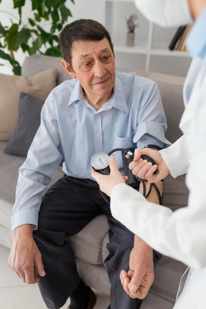 Close up man being checked by doctor