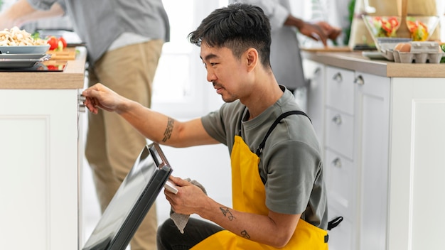 Close up man checking oven