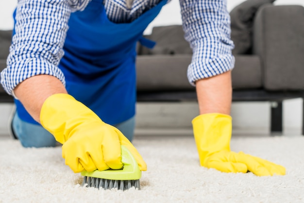 Free photo close up of man cleaning his house