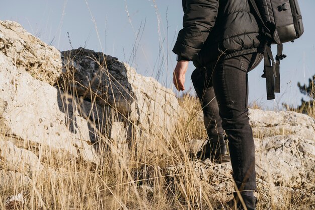 Close-up man climbing rocks