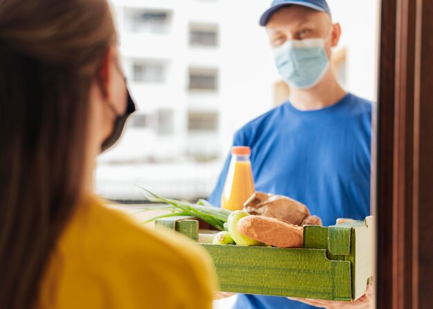 Close-up man delivering food