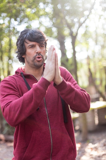 Close-up of man doing breathing exercises